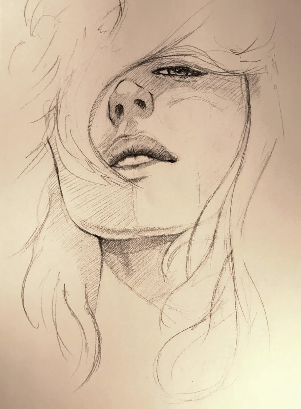 Graphite drawing, woman's face with hair obscuring one eye 