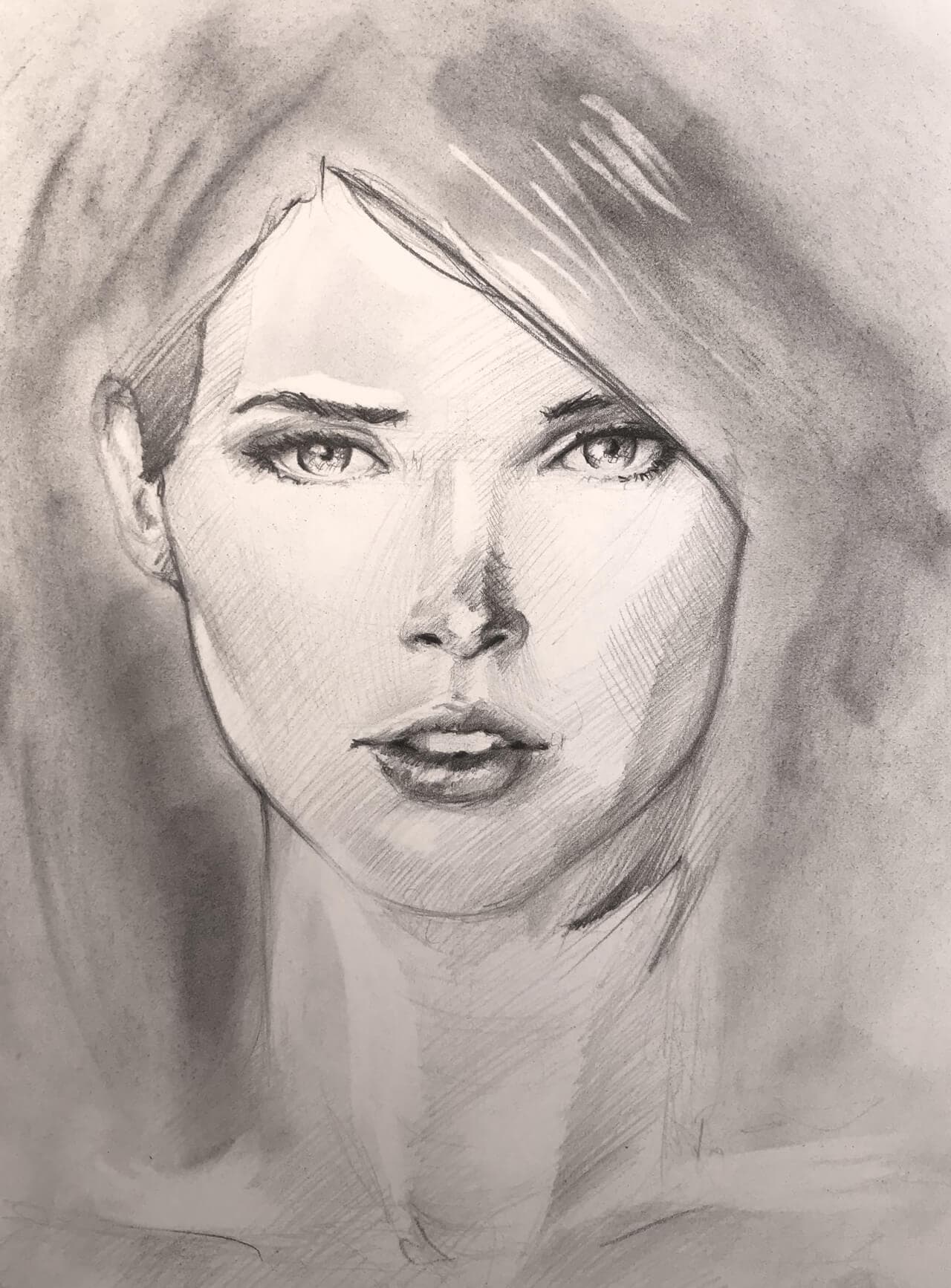 Graphite & charcoal drawing, woman's face close up looking straight ahead