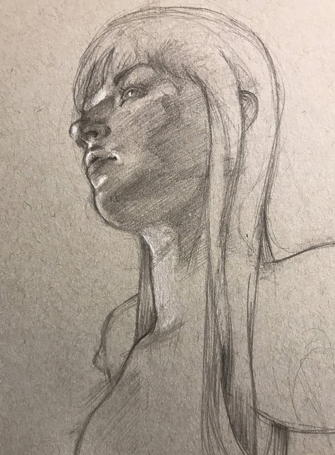 Graphite sketch, looking up at a woman in profile