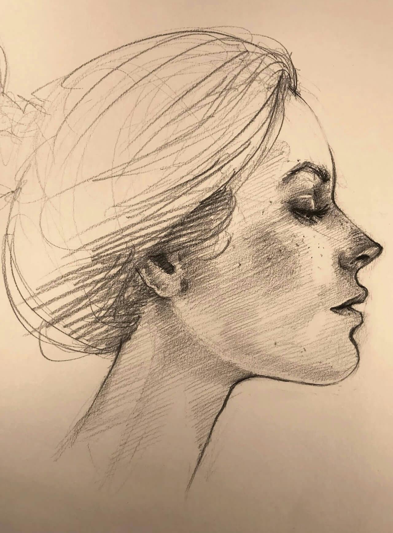 Graphite drawing, woman's face in profile with her hair up