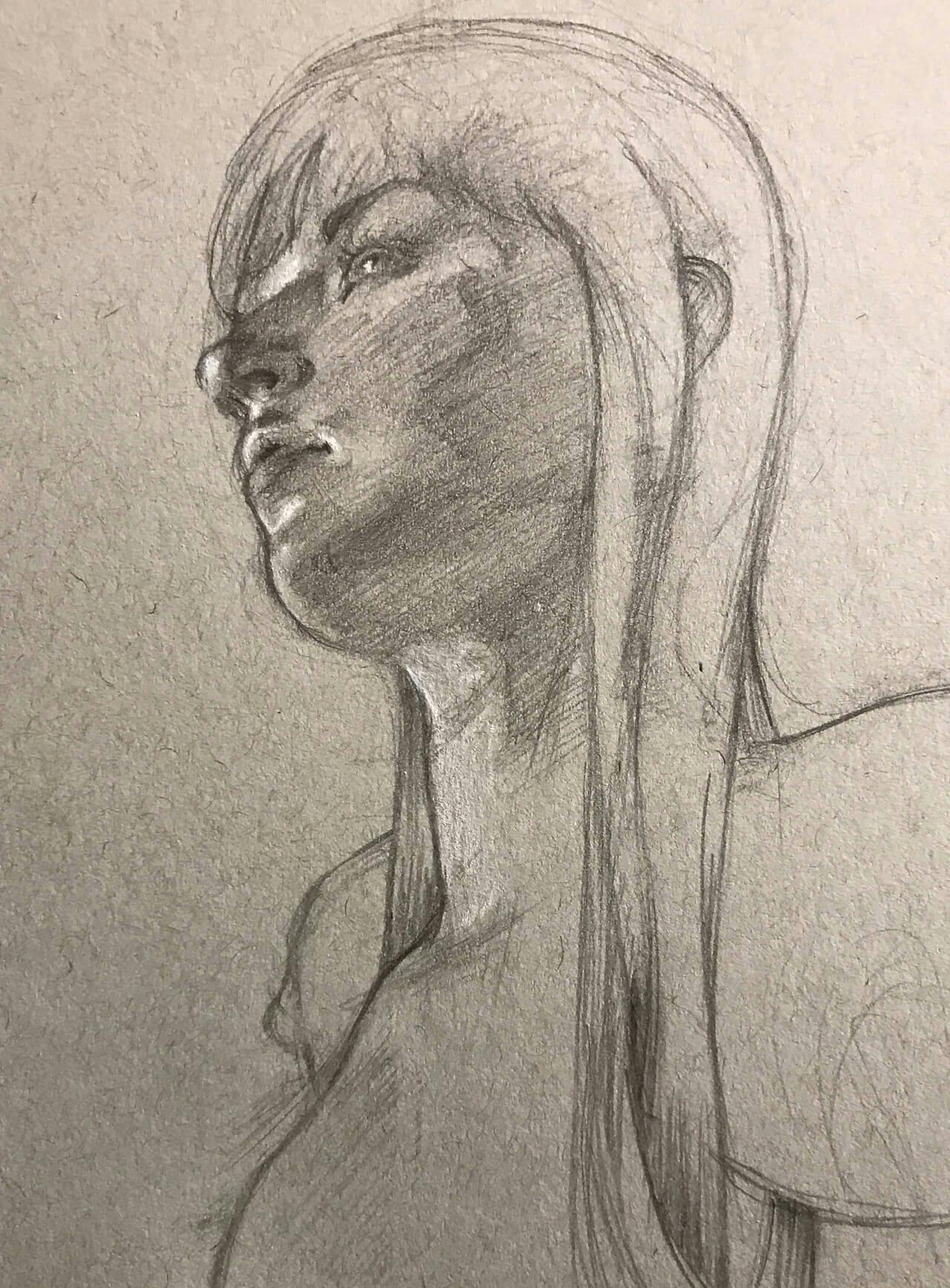 Graphite sketch, looking up at a woman in profile